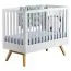 Babybett / Gitterbett Naema 01, Farbe: Weiß / Eiche - Liegefläche: 60 x 120 cm (B x L)