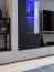 Modische Wohnwand mit LED-Beleuchtung Bjordal 28, Farbe: Schwarz matt / Grau - Abmessungen: 180 x 300 x 35 cm (H x B x T), mit Push-to-open Funktion