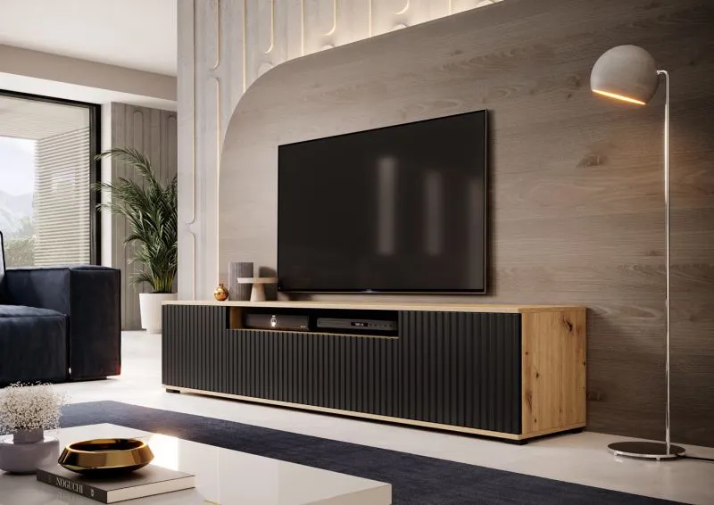 Elegantes TV-Möbel mit geriffelter Front Cienequillas 03, Farbe: Eiche Artisan / Schwarz, mit niedrigen Beinen, Maße: 42 x 200 x 40 cm, modernes und einfaches Design