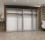 Drehtürenschrank mit vier Kleiderstangen Korab 103, Farbe: Weiß, 3 Meter breit, Griffe: Kaschmir, vier Fächer, Soft-Close-Funktion, Kleiderschrank