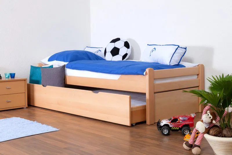 Kinderbett 90 x 200 cm mit Bettkasten (Ausziehbett) 90 x 190 cm als Gästebett | Massivholz: Buche | Natur Lackiert | inkl. 2. Liegeplatz ausziehbar und 2 Rollrost Abbildung